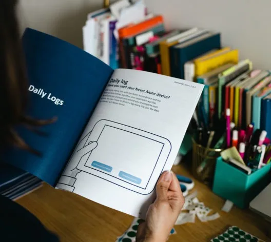 Printed Daily Logs diary study booklet open to a device use question