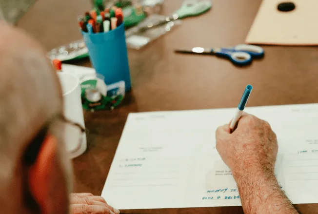 Participant completing a pre-printed workshop response card