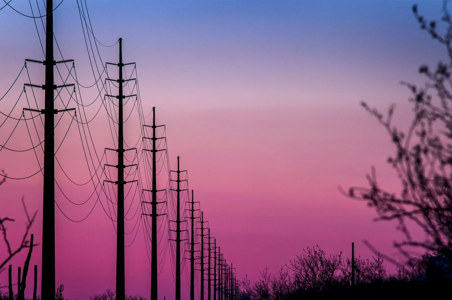 Power transmission lines at sunset — Hubbell Power Systems