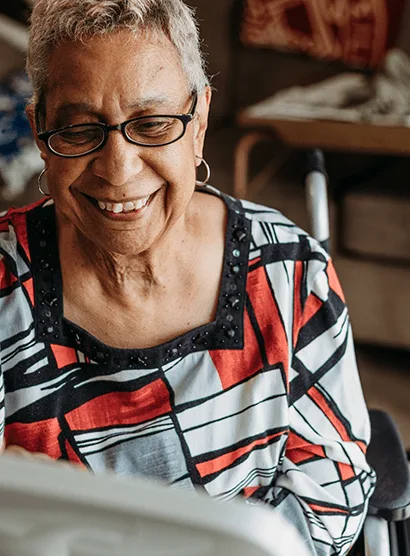 Senior resident on a NeverAlone video call with a care provider