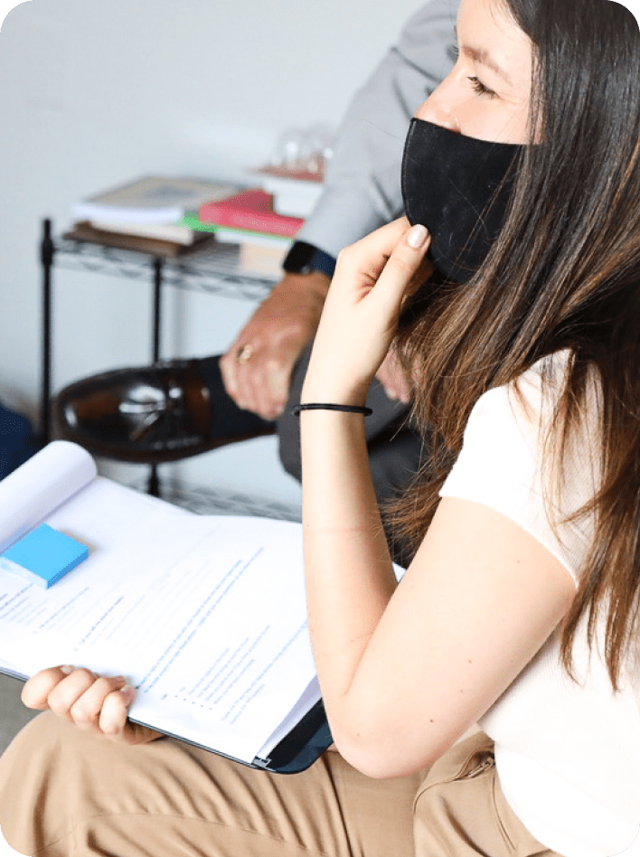 Woman with mask and notepad