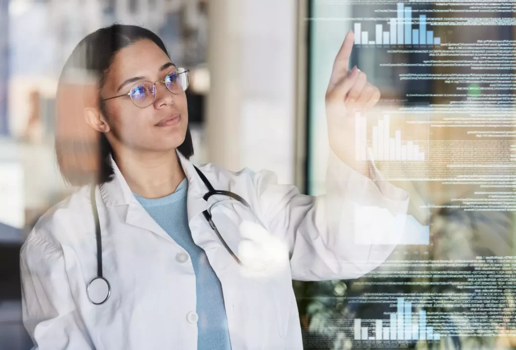 Concept of data analytics in healthcare explored by a female doctor in a lab coat touching a holograph of a bar graph surrounded by written data